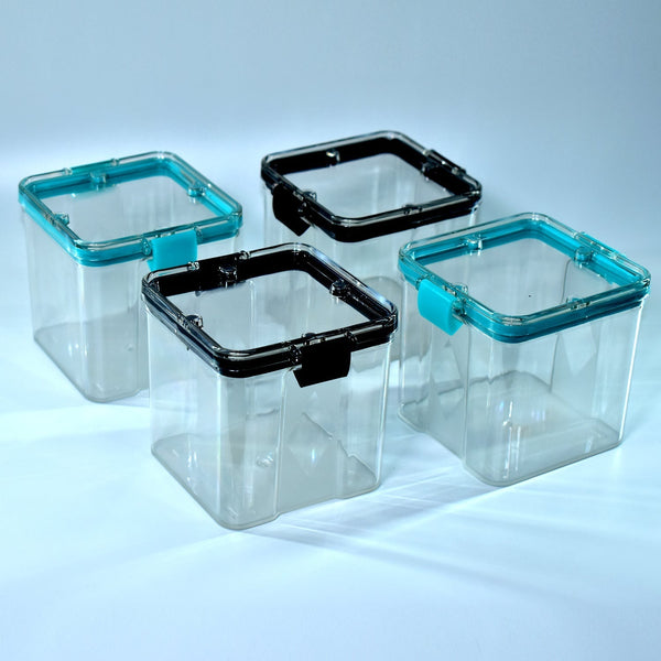 Set of four 700ml square containers, ideal for storing various food items.