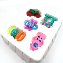 Baby toy rattle with multiple vibrant colors and patterns for visual and tactile stimulation.